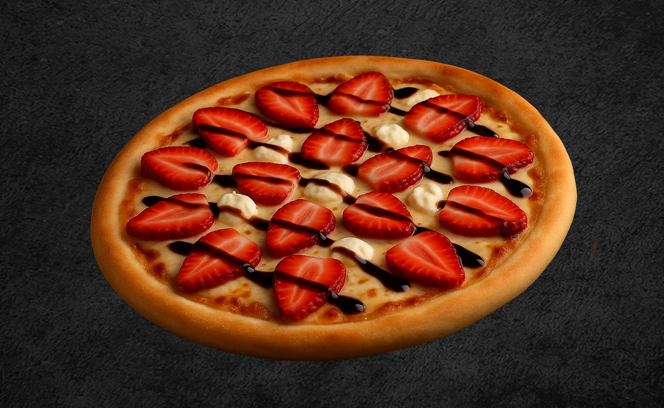 Sweet dessert pizza topped with fresh sliced strawberries, cream dollops, and a drizzle of chocolate sauce on a golden crust.