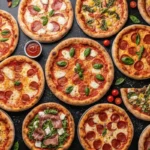 Variety of delicious pizzas with toppings like pepperoni, mozzarella, basil, arugula, and prosciutto, arranged on a dark surface with sauce bowls and fresh ingredients for a gourmet meal.